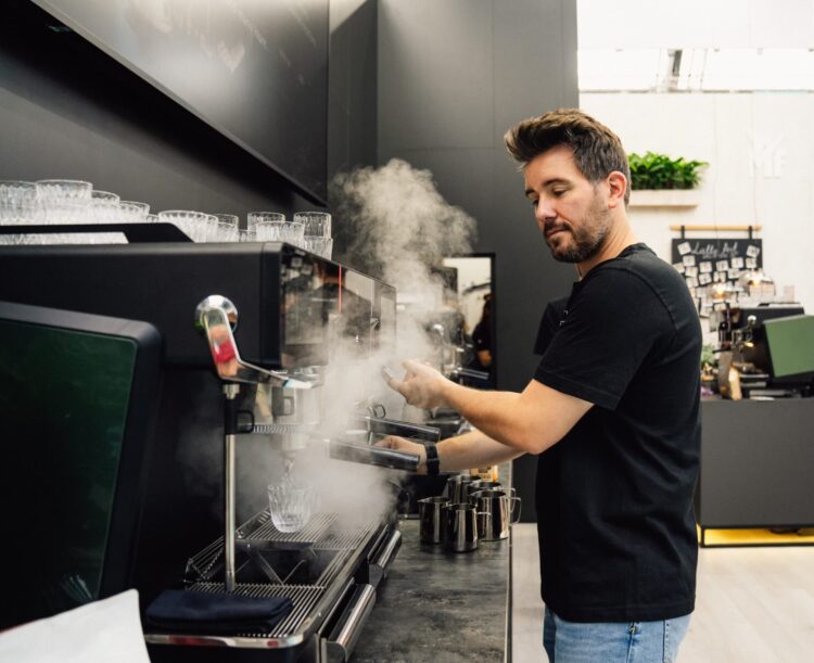 Daniel Gerlach demonstrates WMF espresso NEXT coffee machine.