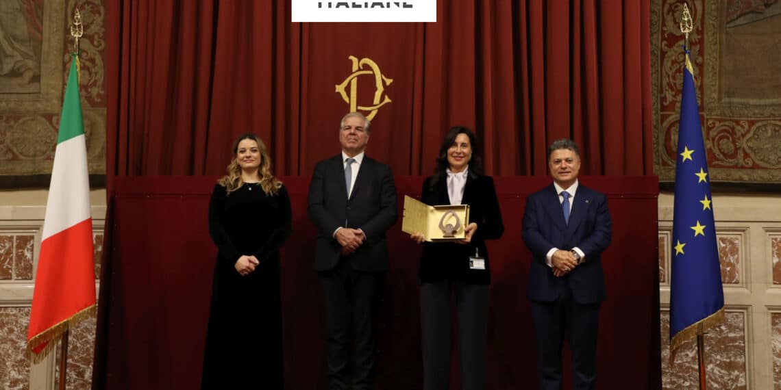 Annalisa Bellante accepts the award on behalf of Cama Group.