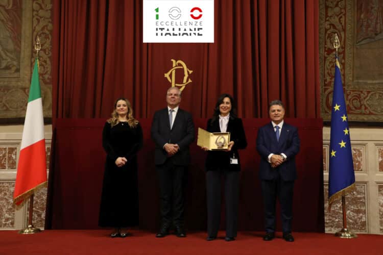 Annalisa Bellante accepts the award on behalf of Cama Group.