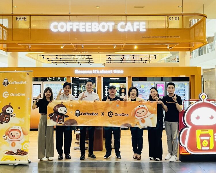 Representatives from CoffeeBot and ONEVERSE celebrate the partnership.